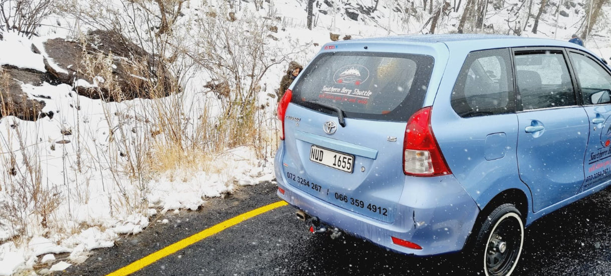 Southern Berg Shuttle Avanza on a snowy Drakensberg pass during a winter transfer