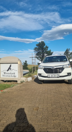 Shuttle at the Witsieshoek Mountain Lodge entrance under a blue Drakensberg sky
