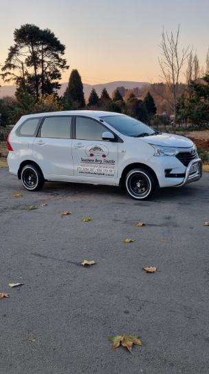 Branded Southern Berg Shuttle Avanza at sunset with the Berg on the horizon