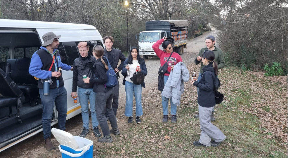 Passenger group beside the shuttle minibus on a bush transfer stop