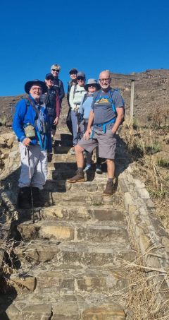 Hiking group on the stone steps of a southern Drakensberg trail