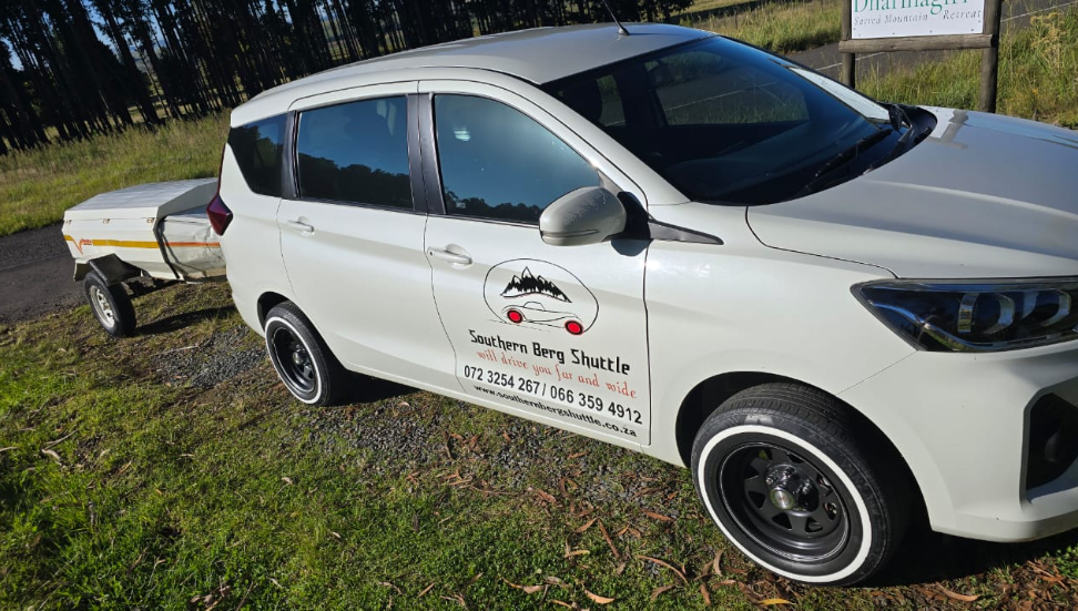 Southern Berg Shuttle branded Suzuki with luggage trailer at Dharmagiri, Southern Drakensberg